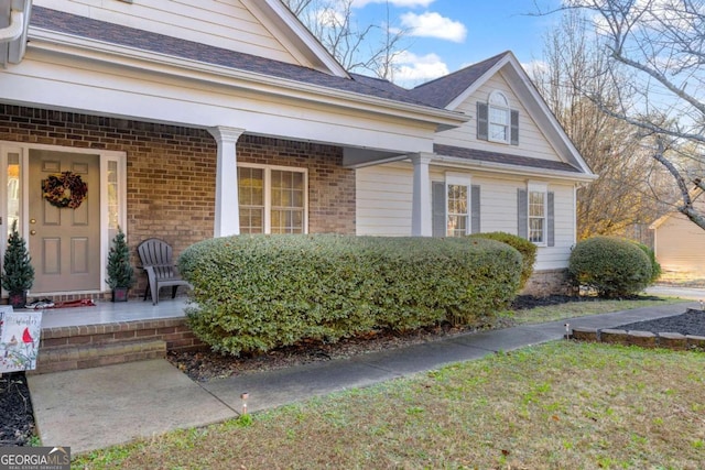 entrance to property with covered porch