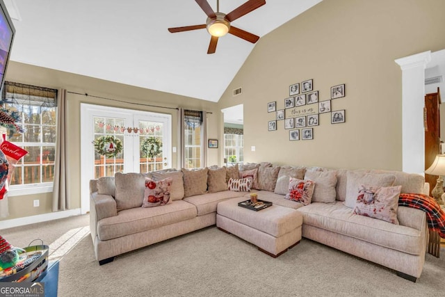 living room with carpet flooring, high vaulted ceiling, and ceiling fan