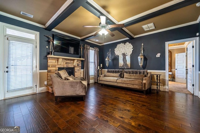 living room with a fireplace, dark hardwood / wood-style flooring, ceiling fan, and ornamental molding