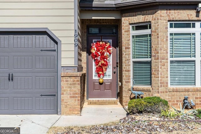 view of exterior entry featuring a garage