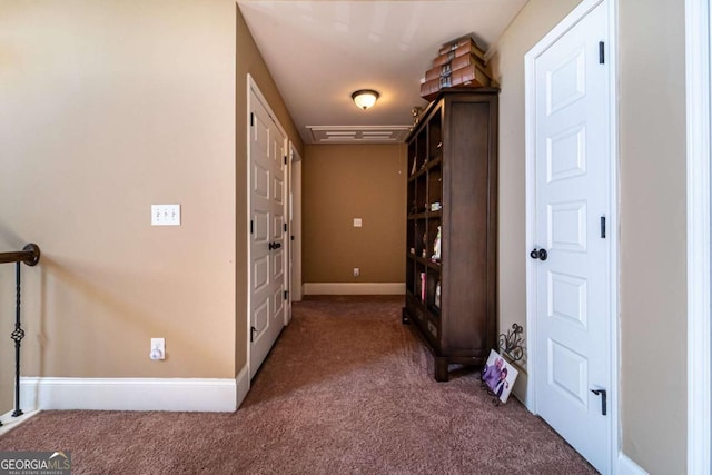 hall featuring dark colored carpet