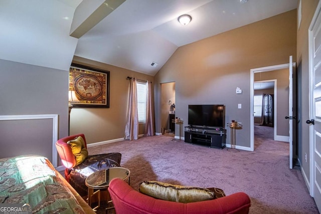 carpeted living room featuring vaulted ceiling