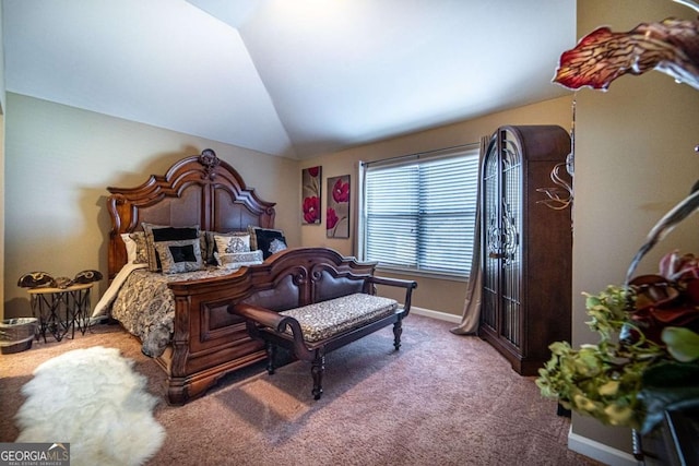 carpeted bedroom with vaulted ceiling