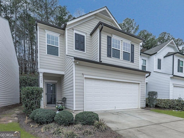 view of front of property featuring a garage