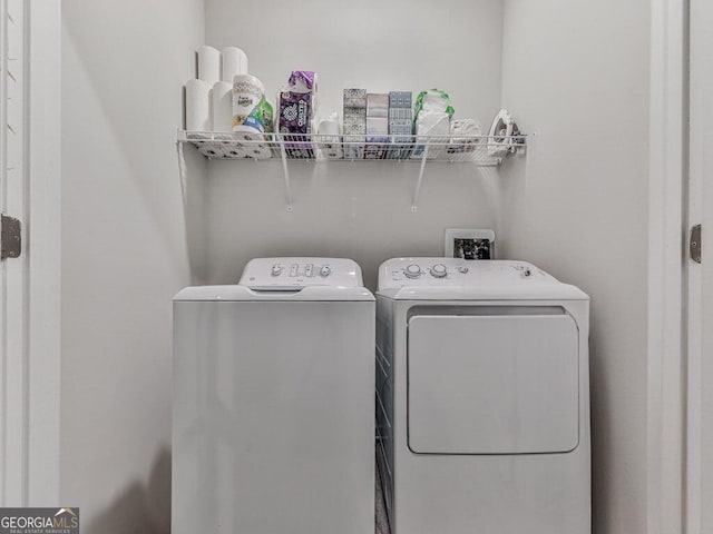 clothes washing area featuring washing machine and dryer