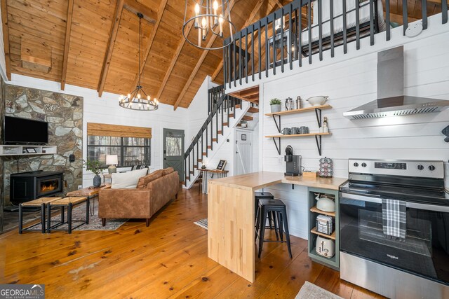 laundry room with dark hardwood / wood-style flooring and washing machine and dryer