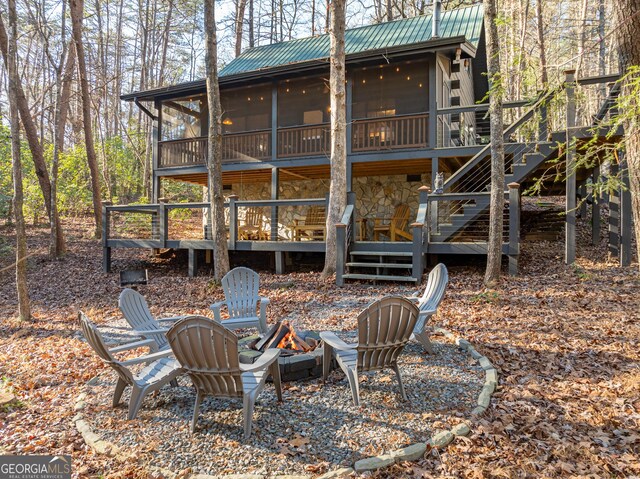 exterior space with a sunroom and a deck