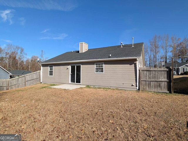 back of property with a patio area