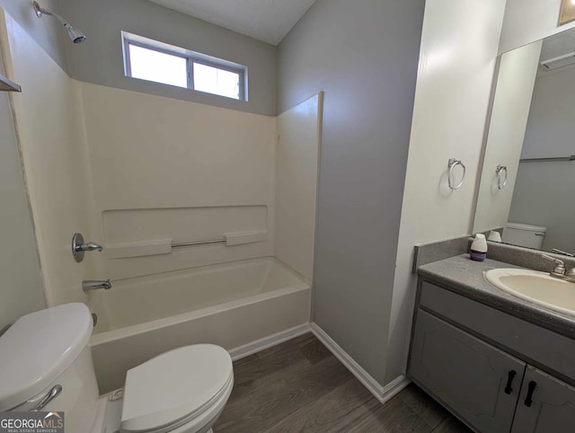 full bathroom with hardwood / wood-style flooring, vanity, toilet, and bathtub / shower combination