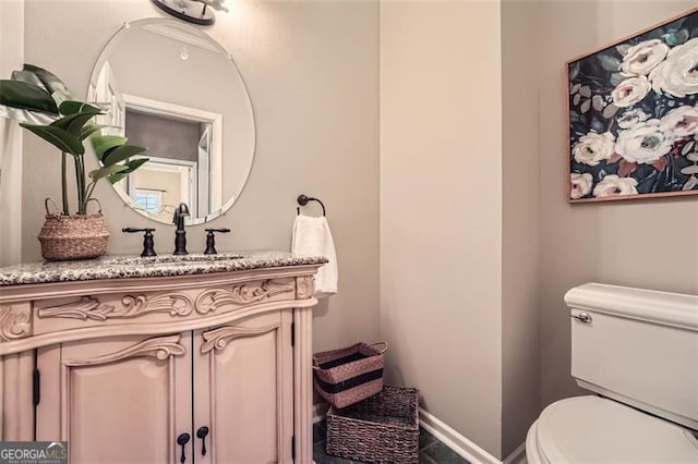 bathroom with vanity and toilet