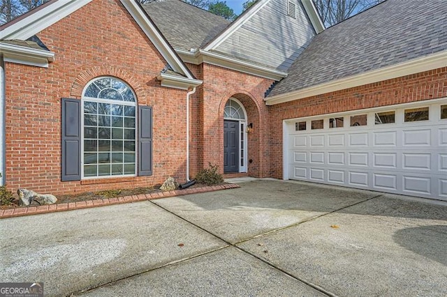 view of exterior entry featuring a garage