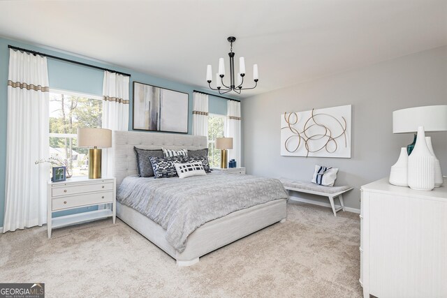 carpeted bedroom featuring a chandelier