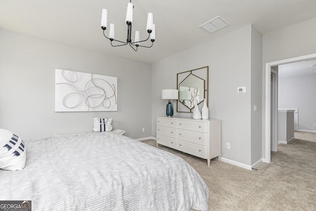 bedroom featuring light carpet and an inviting chandelier