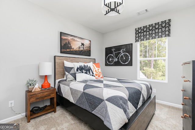 bedroom with light colored carpet