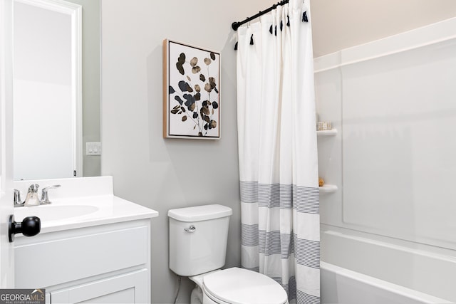 full bathroom featuring shower / bath combination with curtain, toilet, and vanity