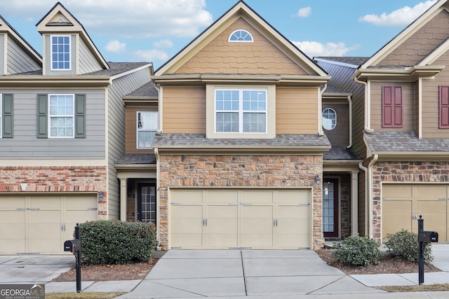 townhome / multi-family property featuring a garage