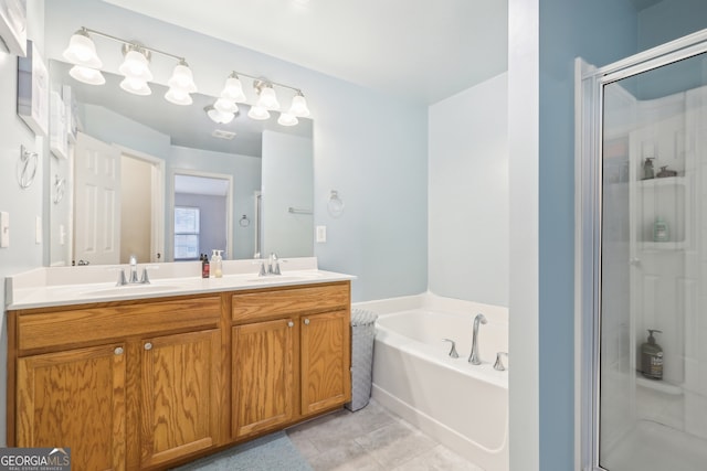 bathroom featuring tile patterned floors, separate shower and tub, and vanity