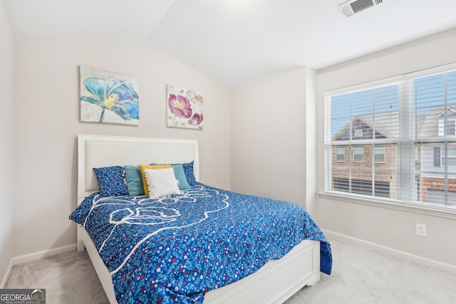 bedroom featuring carpet flooring and lofted ceiling