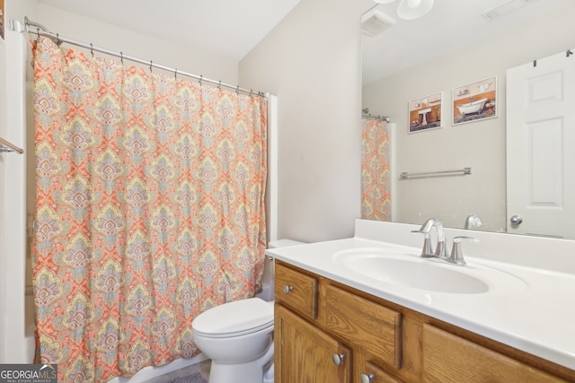 bathroom with vanity and toilet