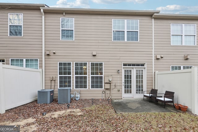 back of property with a patio and cooling unit