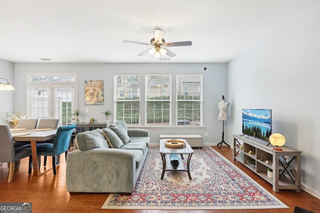 living room featuring ceiling fan and wood-type flooring