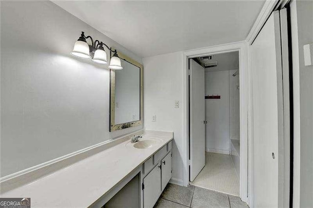 bathroom featuring tile patterned flooring and vanity