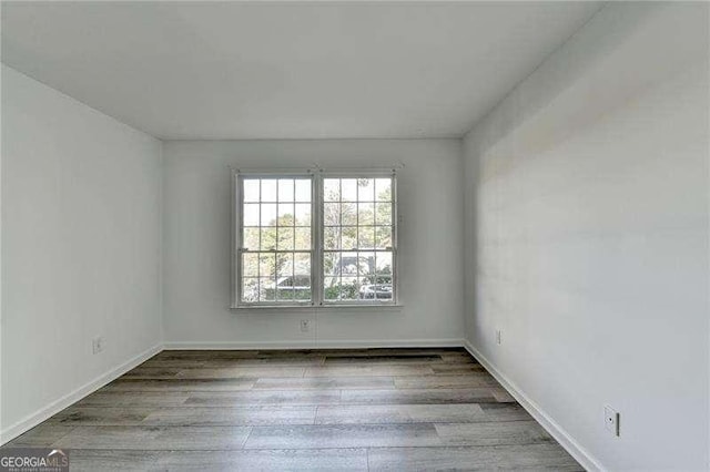 empty room featuring hardwood / wood-style floors