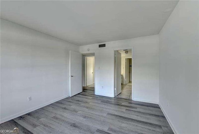 unfurnished room featuring light wood-type flooring