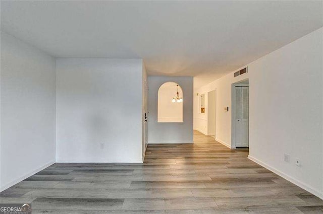 empty room with light hardwood / wood-style floors