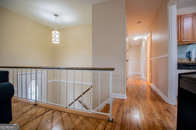 hall with light hardwood / wood-style floors