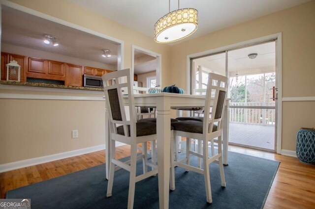 dining space featuring light hardwood / wood-style floors