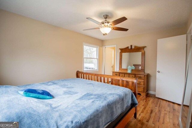 bedroom featuring hardwood / wood-style floors and ceiling fan