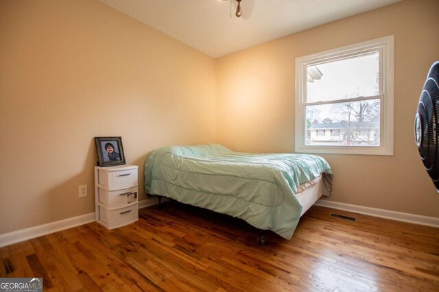 bedroom featuring hardwood / wood-style flooring