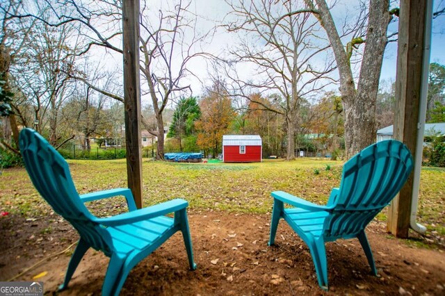 exterior space with a shed and a yard