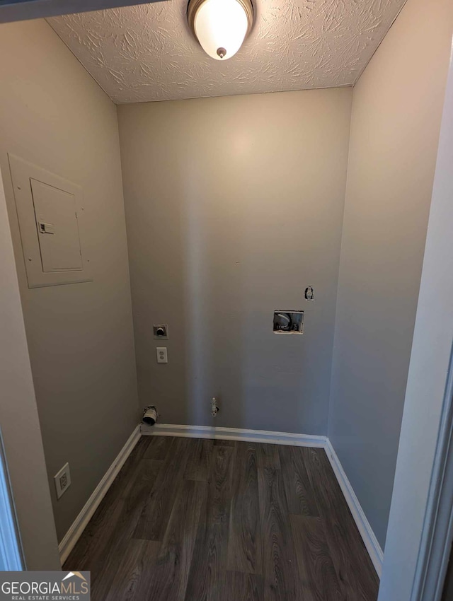 washroom featuring gas dryer hookup, electric panel, washer hookup, hookup for an electric dryer, and dark hardwood / wood-style flooring