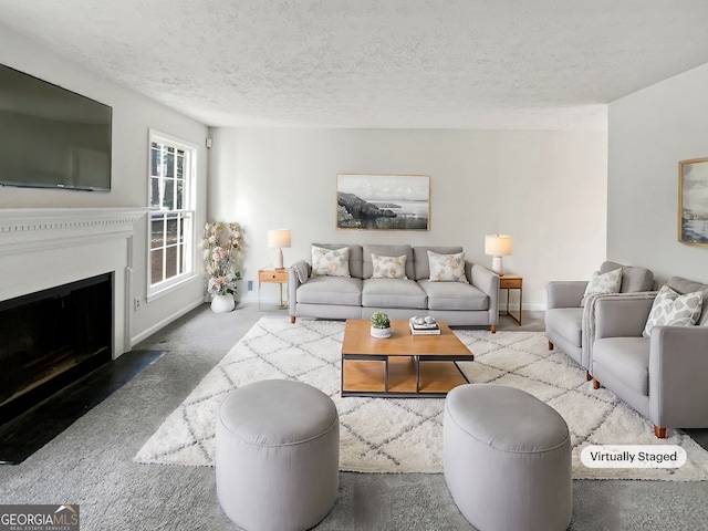 carpeted living room featuring a textured ceiling