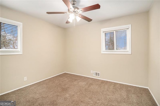 carpeted empty room with ceiling fan