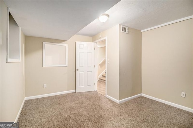 basement featuring carpet