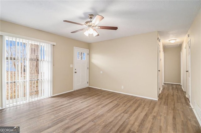 interior space with hardwood / wood-style flooring and ceiling fan