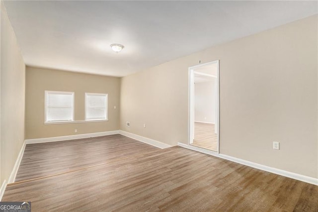 unfurnished room featuring wood-type flooring