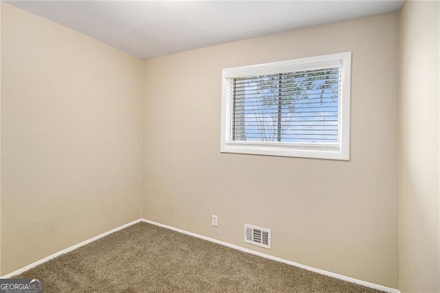 view of carpeted spare room