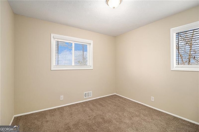 empty room with carpet floors