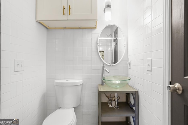 bathroom featuring sink and toilet