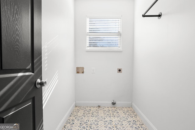 washroom featuring hookup for an electric dryer, hookup for a washing machine, and light tile patterned flooring