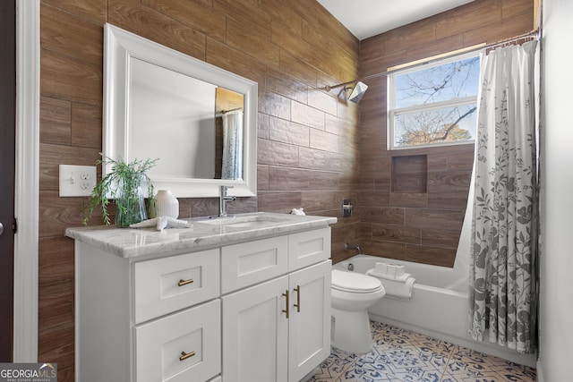 full bathroom featuring shower / bath combination with curtain, vanity, toilet, and tile patterned floors