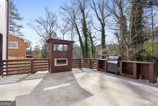 view of patio featuring a grill