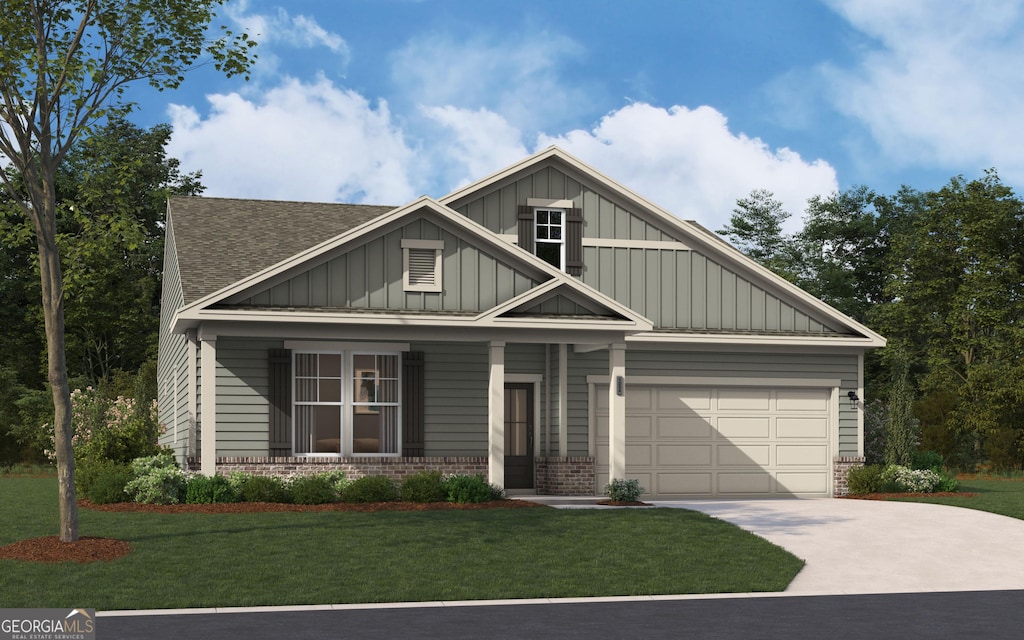 craftsman house featuring a front yard and a garage