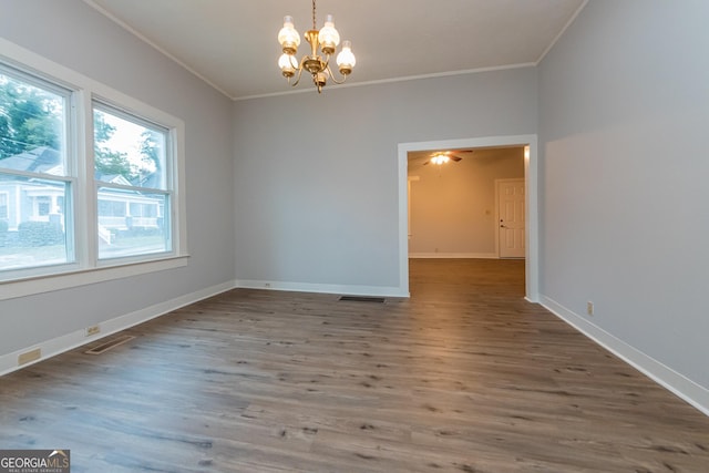 unfurnished room with a chandelier, wood-type flooring, and crown molding