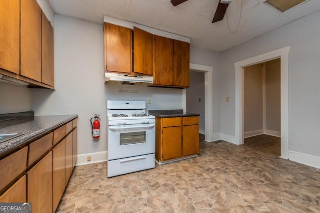 kitchen with gas range gas stove and ceiling fan