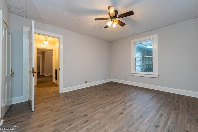 unfurnished room with ceiling fan and wood-type flooring